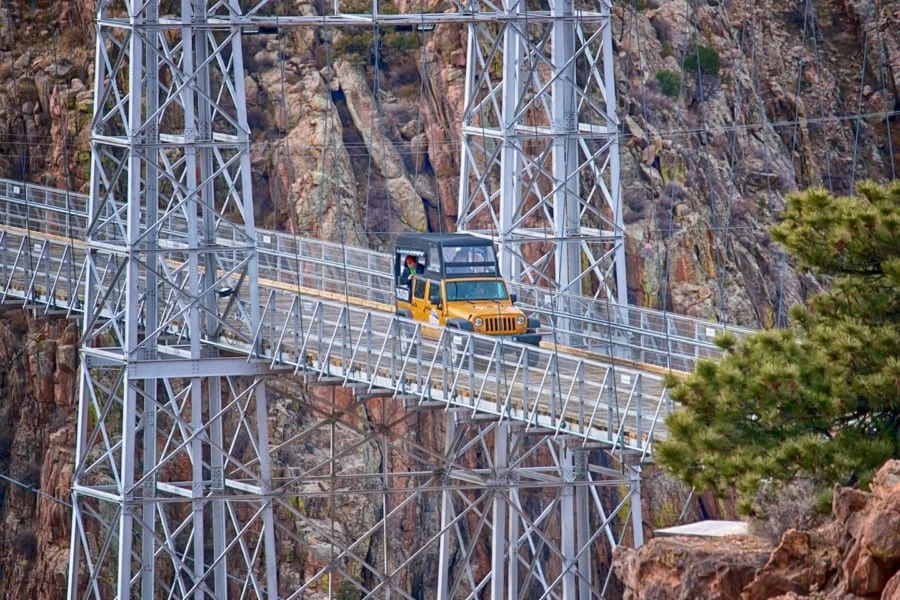 Colorado Jeep Tours riding yellow jeep over Royal Gorge Bridge