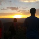 tourists enjoying the sunset over the mountains during a Colorado Jeep Tour