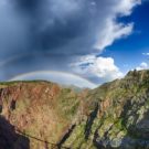 scenic view of canyon and two rainbows through clouds Colorado Jeep Tours