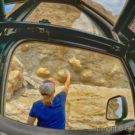 woman tourists touching rock formation Colorado Jeep Tours