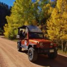 Fall Foliage Colorado Jeep Tour on dirt road with changing leaves in background