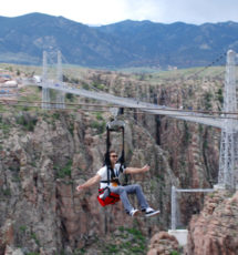 male enjoying zip line over Royal Gorge Colorado Jeep Tours