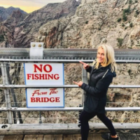 local TV personality points to signage on the Royal Gorge Royal Gorge Canon City Colorado