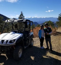couple poses for a scenic photo next to a Play Dirty ATV Royal Gorge Canon City Colorado