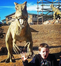 young boy makes the same face as a dinosaur for fun Royal Gorge Canon City Colorado