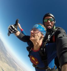 tandem skydiving jump with man having fun and nervous woman near Canon City Colorado